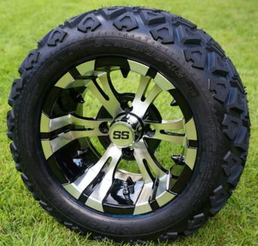 A rugged off-road tire with a shiny SS alloy wheel on grass.