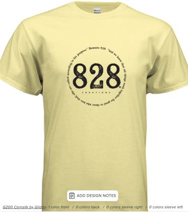 Light yellow T-shirt with a black circular 828 Creations logo and Romans Bible verse text.