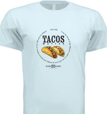 Light blue t-shirt with tacos and 'Tacos Matter' text in center.