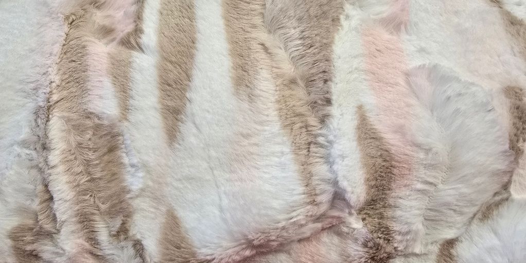 Soft, striped fur texture in beige, white, and pale pink tones.