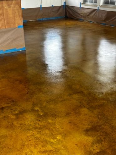 Polished stained concrete floor with reflective surface.