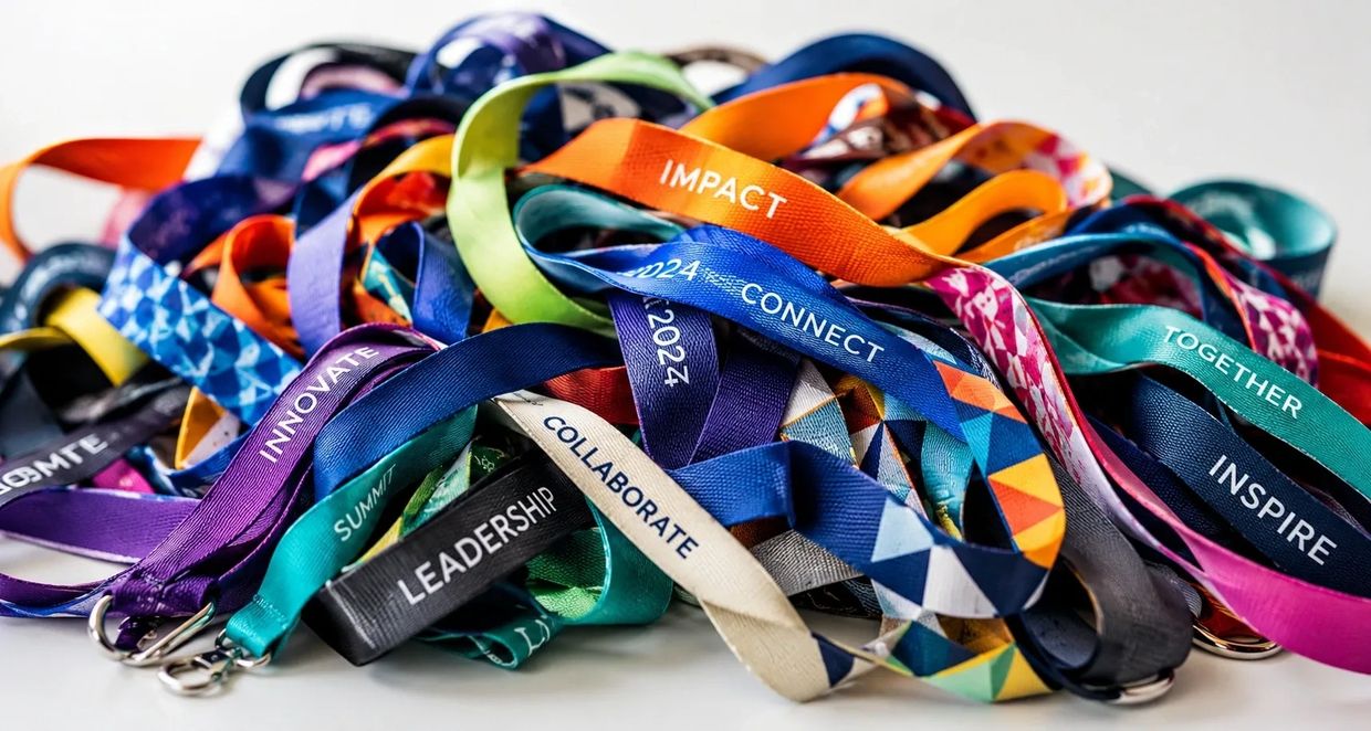 Colorful event lanyards with motivational words.