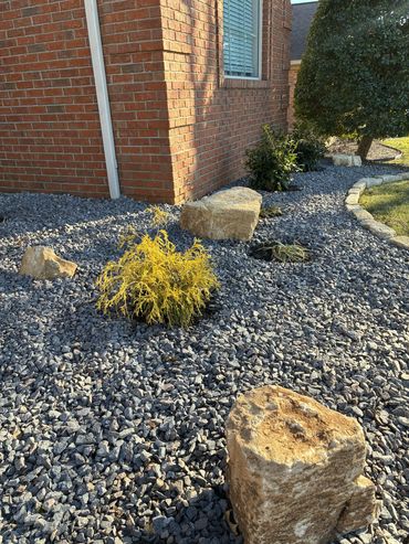 Limestone boulders with purple trap rock design in Evansville, IN