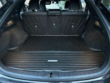 Empty car trunk with protective mat.