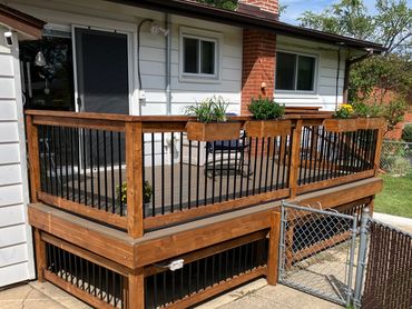 New Dekorator's composite decking over existing structure. Railing system top and bottom to keep th