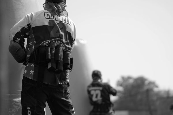 Two paintball players preparing for a match.