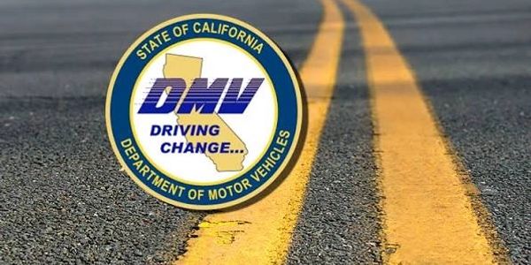 California DMV logo over a road with double yellow lines.
