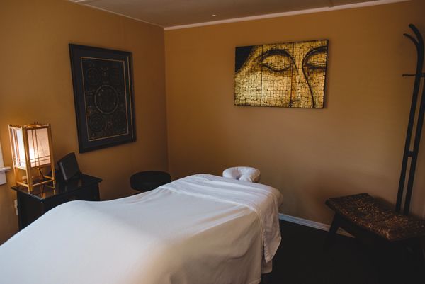 Cozy massage room with Buddha art