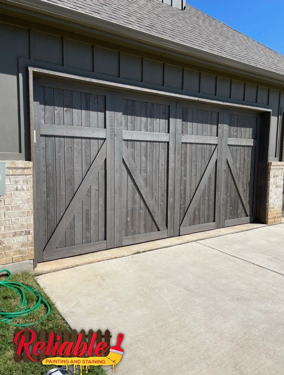 Wood garage door staining project in Northlake, Texas by Reliable Painting and Staining.