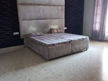 Modern bed in a minimally decorated room.