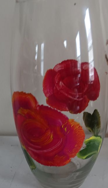 Large glass vase with red roses 
