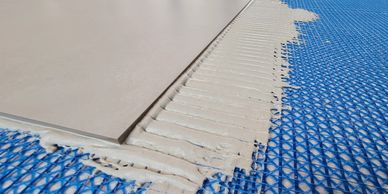 Thin-set mortar full coverage under tile