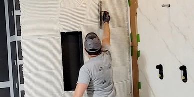 Thin-set mortar application over shower walls
