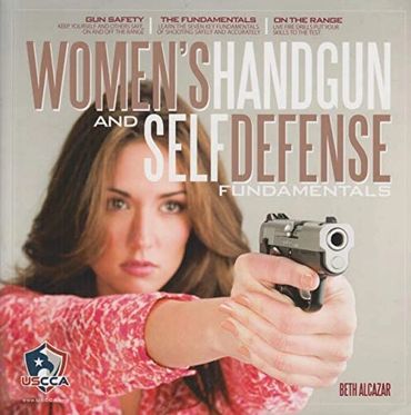 Woman pointing a handgun in self defense