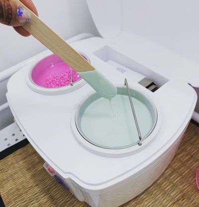 The waxing station show tea tree strip wax and justwax berrylicious pink hard hot wax