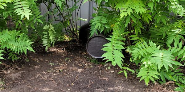 High-quality outdoor audio system with speakers in a landscaped Vaughan backyard.