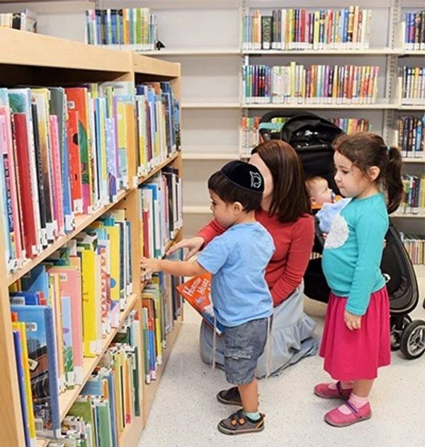 Toddlers browsing for books.
