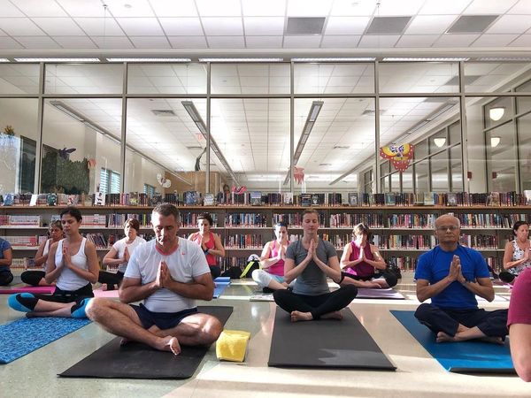 People doing yoga at the library.