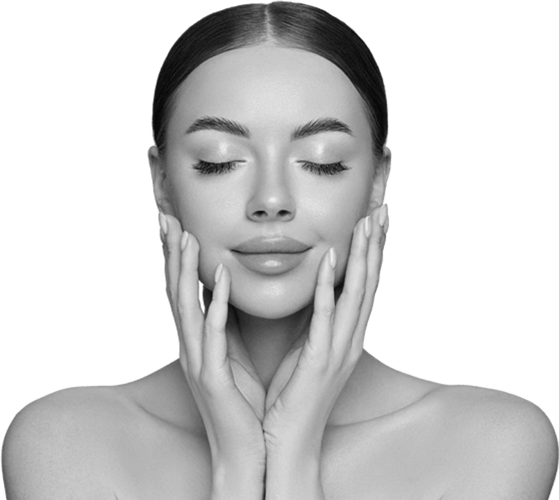 Woman with flawless skin gently touching her face, eyes closed.