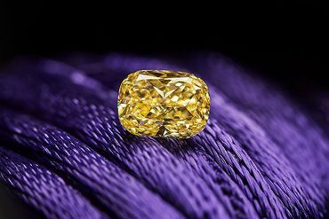 Yellow diamond on a purple fabric.