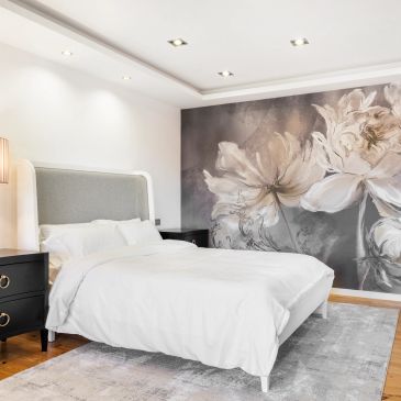 Modern bedroom with a large floral mural.