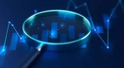 Magnifying glass focusing on digital blue financial charts and graphs.