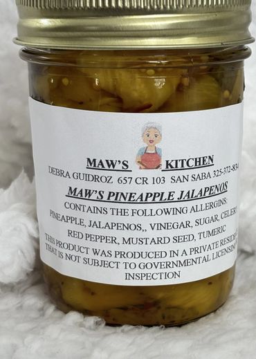 Jar of Maw's Pineapple Jalapenos with homemade label and ingredients.