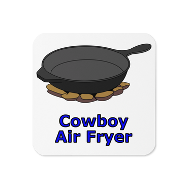 Cast iron skillet on rocks labeled 'Cowboy Air Fryer'.