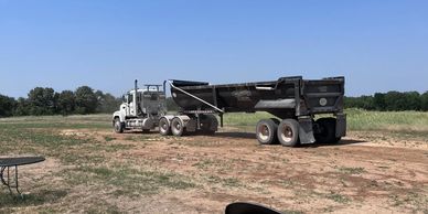 Eighteen wheeler truck brings in loads of dirt for the new airstrip at WAMS RC Club