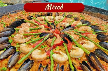 Mixed seafood paella with shrimp, mussels, asparagus, and peas.