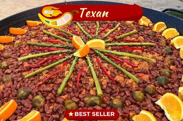 Texan mild paella with asparagus, red peppers, Brussels sprouts, and orange slices.