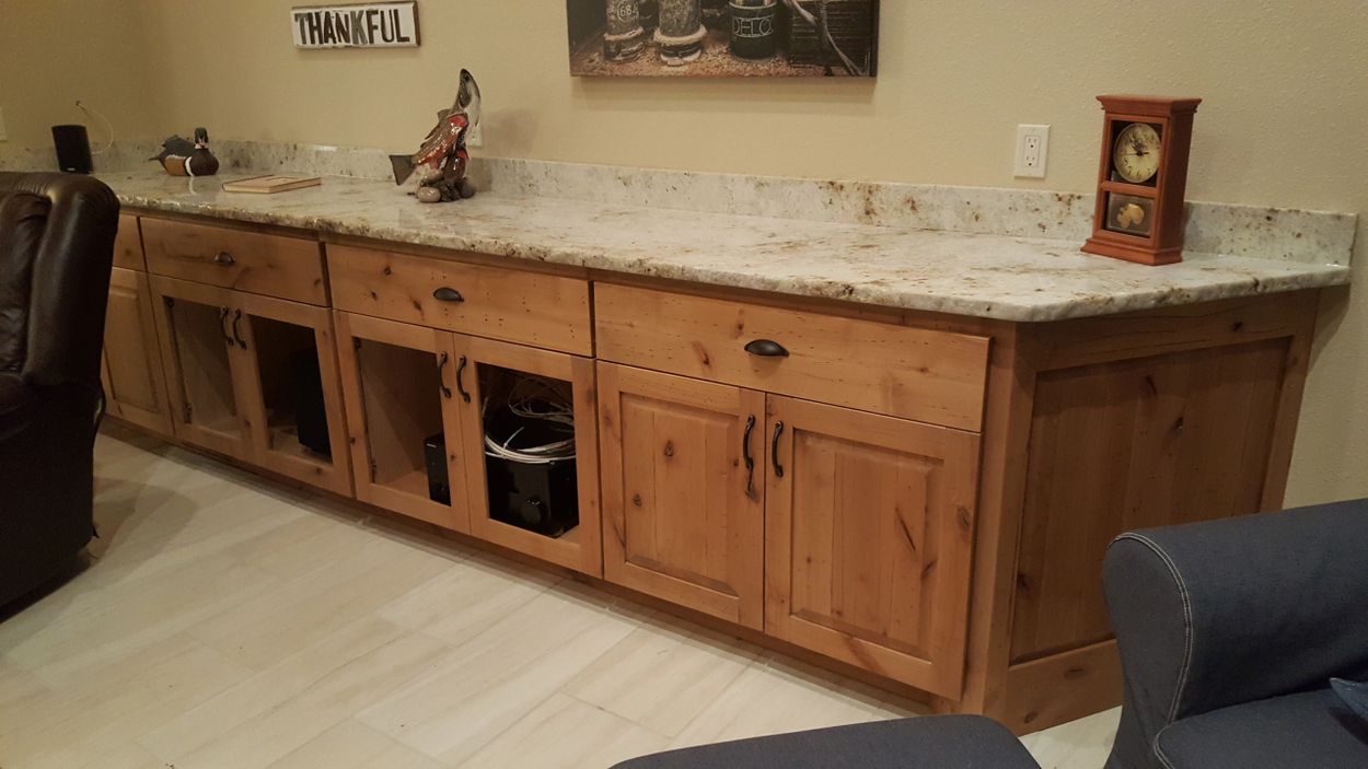 Pagosa cabinets, custom antiqued knotty alder kitchen cabinets.