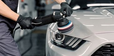 Polishing near the headlight of a Ford Mustang GT