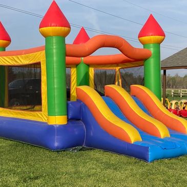 A large bouncehouse with two slides on the front-facing end.