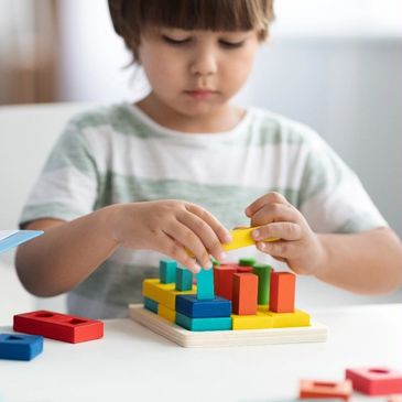 A child playing with building blocks.