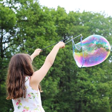 A child with a bubble wand.