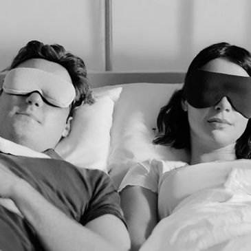 Clients relaxing with sleeping masks during a scalar and rifing session at Quantum Scalar Lounge,