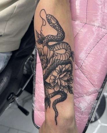 blackwork snake and peony tattoo