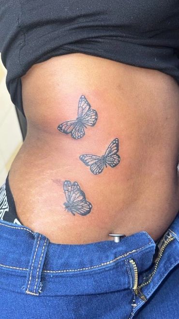 butterflies rib tattoo for women