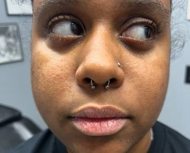 septum piercing done at our fort myers tattoo and piercing shop