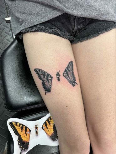womens black and grey butterfly thigh tattoo fort myers florida tattoo shops near me
