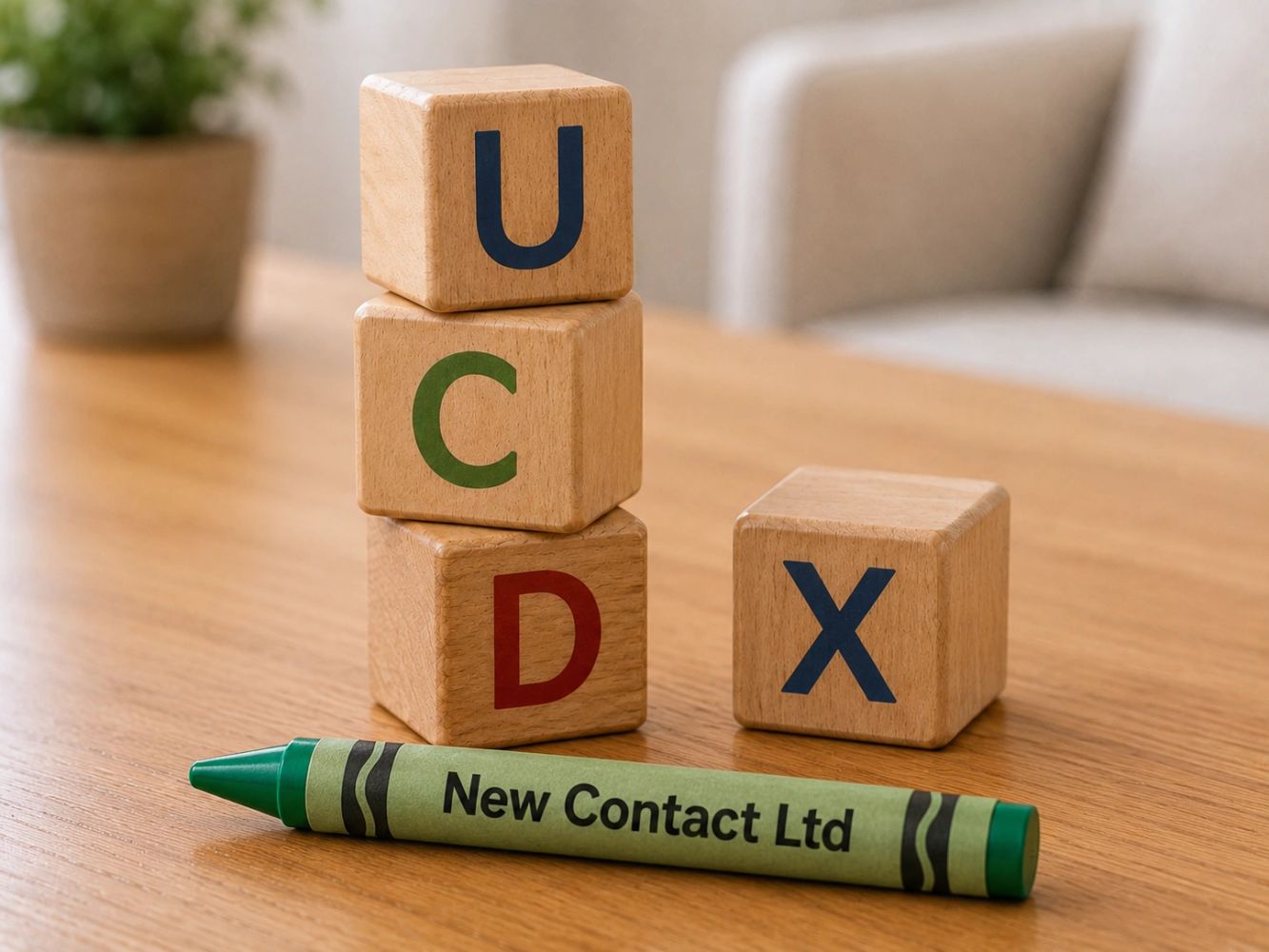 Wooden blocks stacked with a green crayon labeled 'New Contact Ltd'