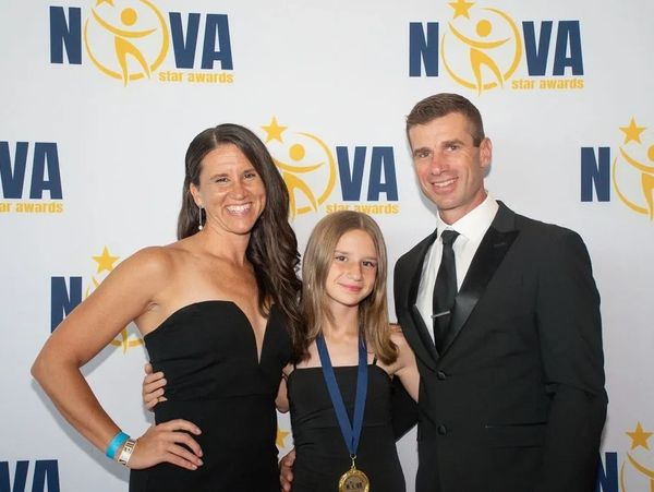 A family dressed formally at the Nova Star Awards event.