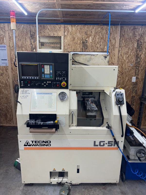 A Tecno Wasino LG-5H CNC machine in a workshop.