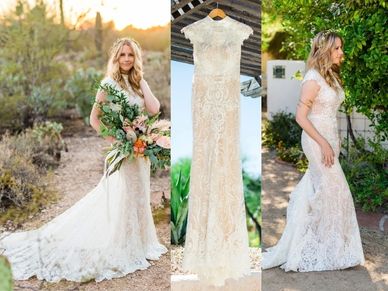 Elegant lace wedding dress with floral bouquet and headpiece.