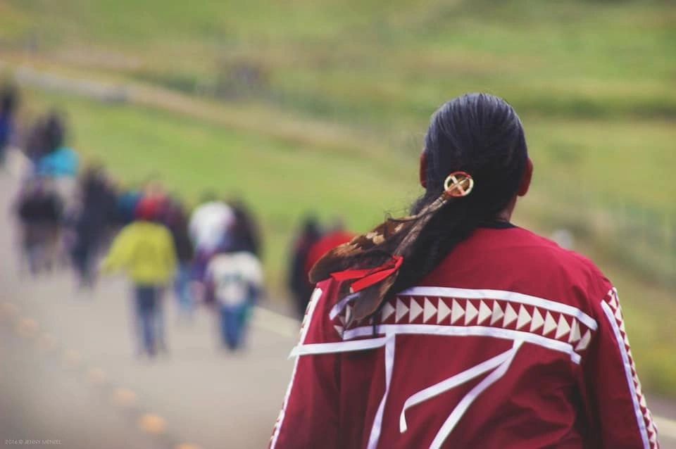 Lakota man  walking to prayer circle at Standing Rock.