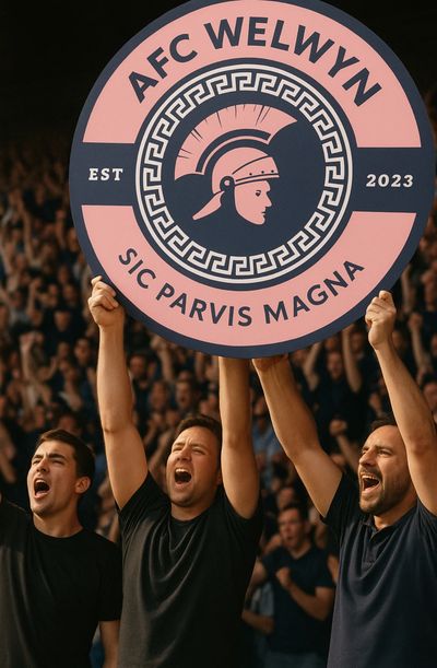 AFC Welwyn supporters holding the AFC Welwyn badge