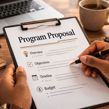 Person working on a program proposal with a pen.