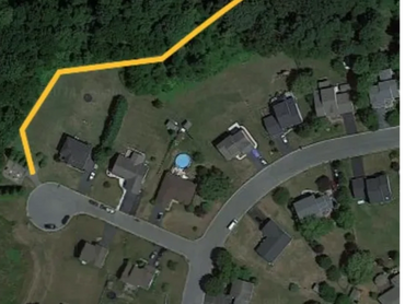 West entrance of the Woodland Trail, near the pumping station on Bolton Court.