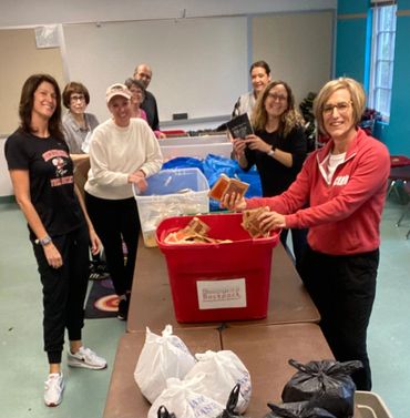 Helping Hungry Kids volunteers packing weekend food bags